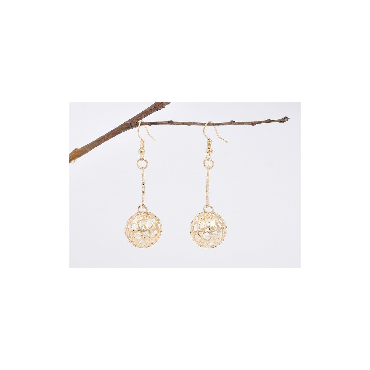Hollow out goden ball earrings